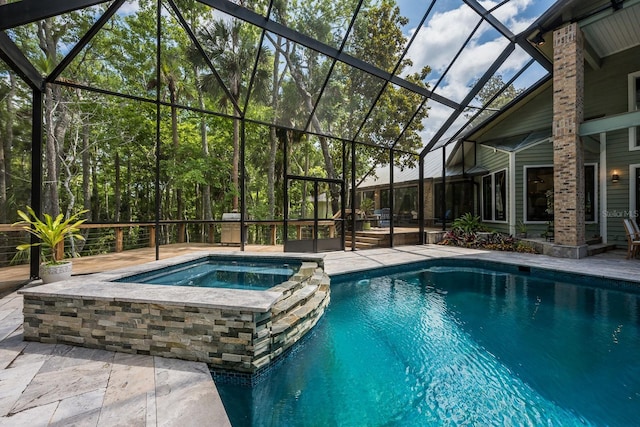 20 Twelve Oaks Trl, Ormond Beach, FL 32174 - view of pool featuring glass enclosure, a patio, and a pool with connected hot tub