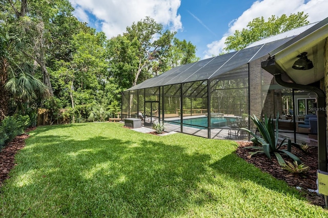 20 Twelve Oaks Trl, Ormond Beach, FL 32174 - view of green lawn with an outdoor pool and a patio