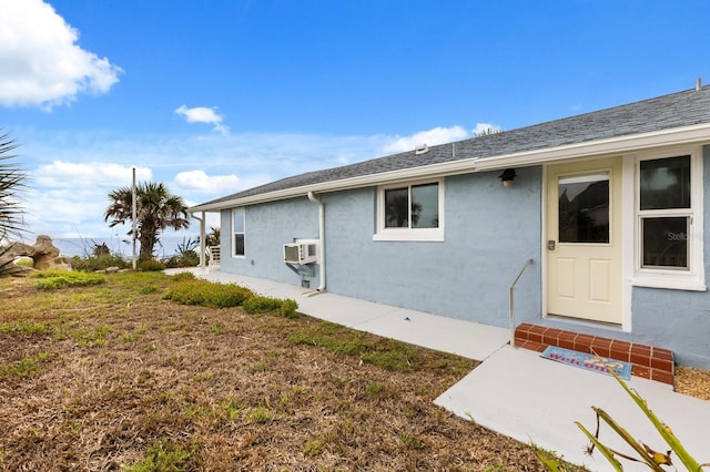 4039 S Atlantic Ave, Port Orange, FL 32127 - rear view of house featuring stucco siding