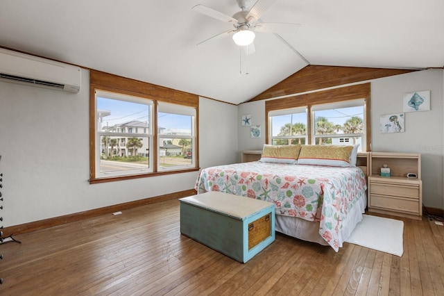 4039 S Atlantic Ave, Port Orange, FL 32127 - bedroom with a wall mounted AC, vaulted ceiling, hardwood / wood-style flooring, and a ceiling fan