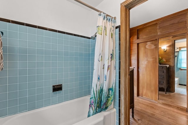4039 S Atlantic Ave, Port Orange, FL 32127 - full bathroom with wood finished floors and shower / tub combo