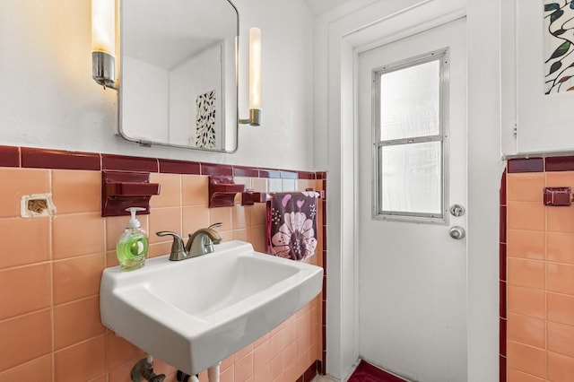 4039 S Atlantic Ave, Port Orange, FL 32127 - bathroom featuring a sink and tile walls