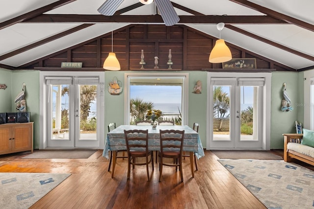 4039 S Atlantic Ave, Port Orange, FL 32127 - dining area with beamed ceiling, healthy amount of natural light, hardwood / wood-style floors, french doors, and high vaulted ceiling