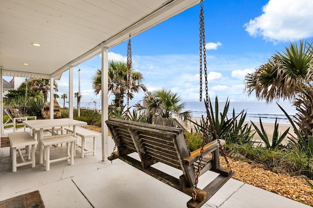 4039 S Atlantic Ave, Port Orange, FL 32127 - view of patio / terrace featuring outdoor dining area and a water view