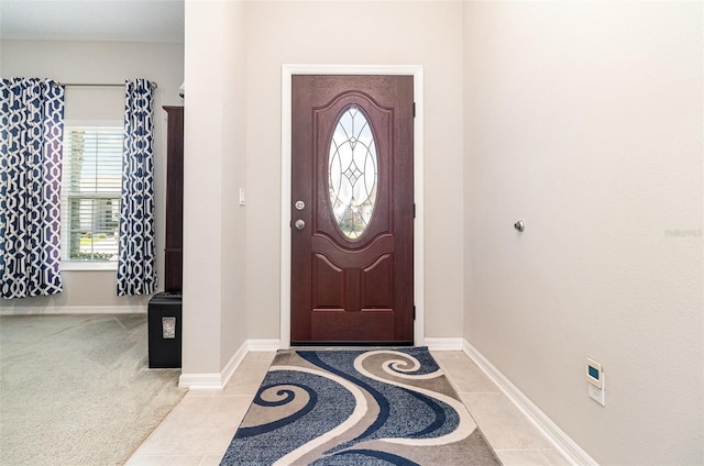 3349 Sagebrush St, Harmony, FL 34773 - entryway with baseboards and light tile patterned floors