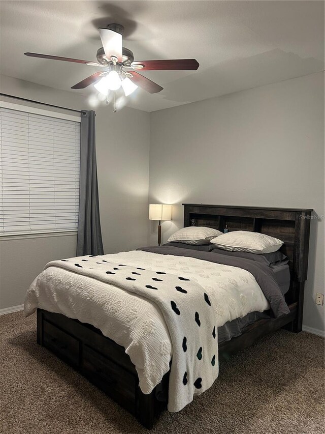 3417 Westchester Square Blvd Unit 202, Orlando, FL 32835 - bedroom featuring carpet flooring, baseboards, and ceiling fan