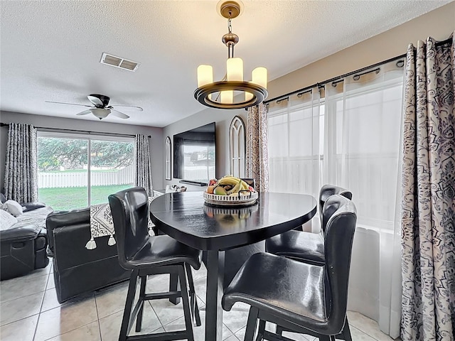1803 Meadow Pond Way, Orlando, FL 32824 - dining room with a textured ceiling, ceiling fan, and light tile patterned floors