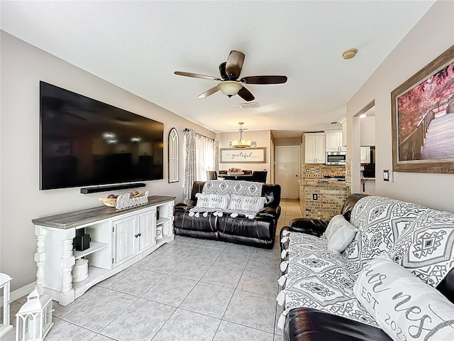 1803 Meadow Pond Way, Orlando, FL 32824 - living room featuring light tile patterned floors and a ceiling fan
