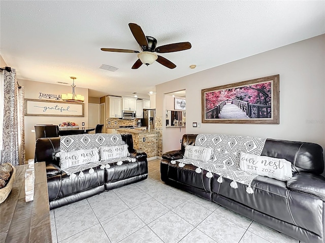 1803 Meadow Pond Way, Orlando, FL 32824 - living area with ceiling fan and light tile patterned floors