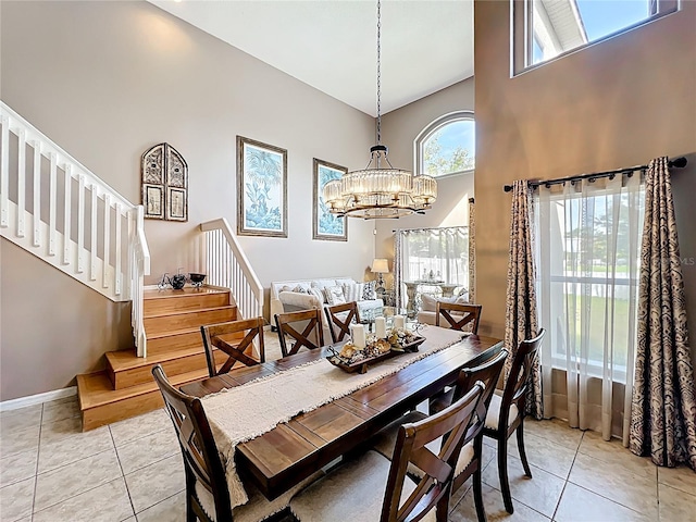 1803 Meadow Pond Way, Orlando, FL 32824 - dining room with stairway, a high ceiling, light tile patterned floors, and a chandelier