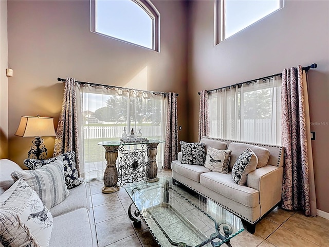 1803 Meadow Pond Way, Orlando, FL 32824 - living area featuring healthy amount of natural light, a high ceiling, and tile patterned floors