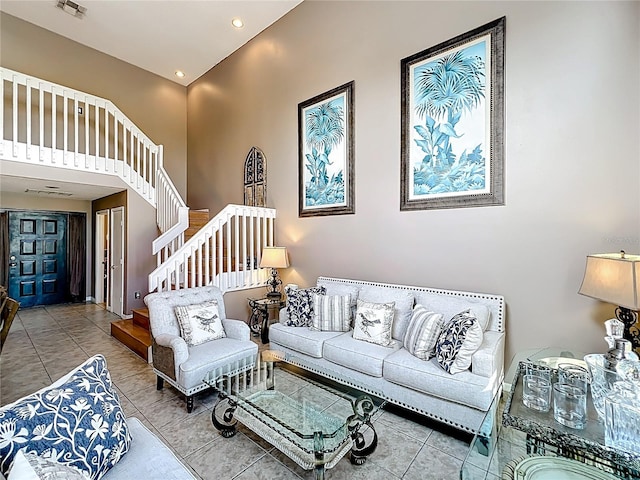 1803 Meadow Pond Way, Orlando, FL 32824 - tiled living room with a high ceiling, stairs, and recessed lighting