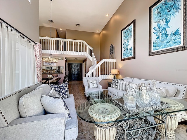 1803 Meadow Pond Way, Orlando, FL 32824 - living room featuring stairs, high vaulted ceiling, tile patterned floors, and a chandelier