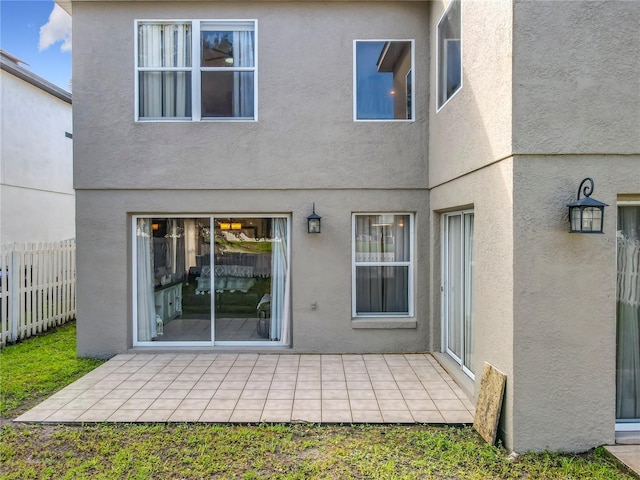 1803 Meadow Pond Way, Orlando, FL 32824 - back of property featuring a patio and stucco siding