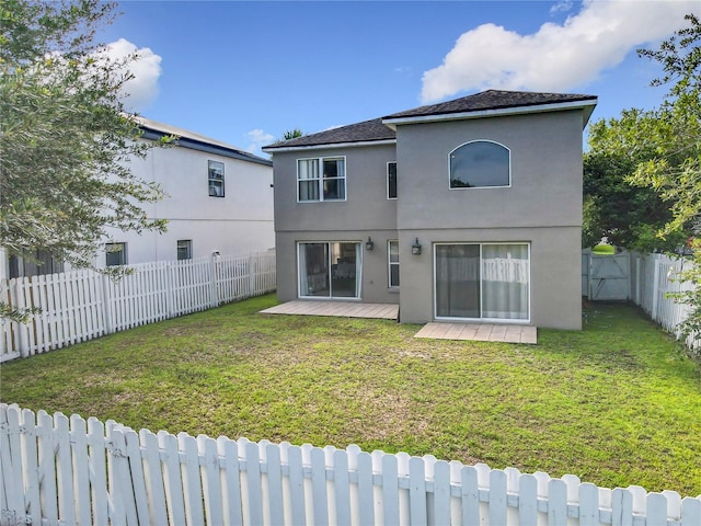 1803 Meadow Pond Way, Orlando, FL 32824 - back of house featuring stucco siding and a wooden deck