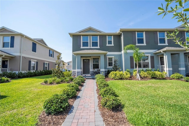 13452 Sagestone Dr, Winter Garden, FL 34787 - townhome / multi-family property featuring stucco siding and a front yard