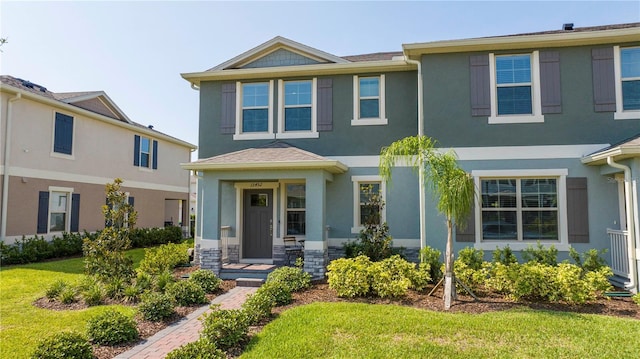 13452 Sagestone Dr, Winter Garden, FL 34787 - view of front of property featuring stucco siding and a front lawn
