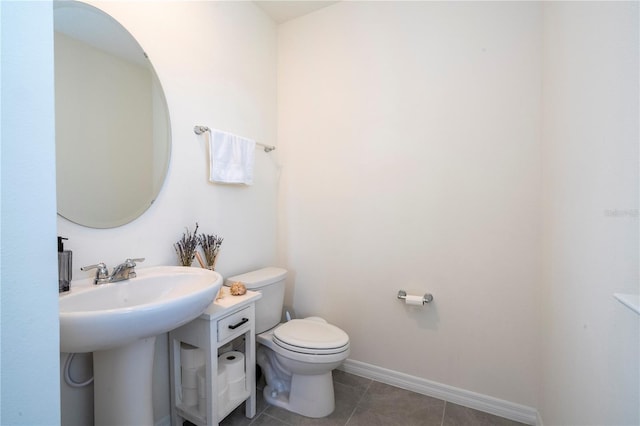 13452 Sagestone Dr, Winter Garden, FL 34787 - bathroom featuring toilet, tile patterned floors, and baseboards