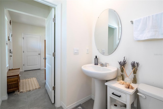 13452 Sagestone Dr, Winter Garden, FL 34787 - bathroom featuring toilet, tile patterned floors, and baseboards