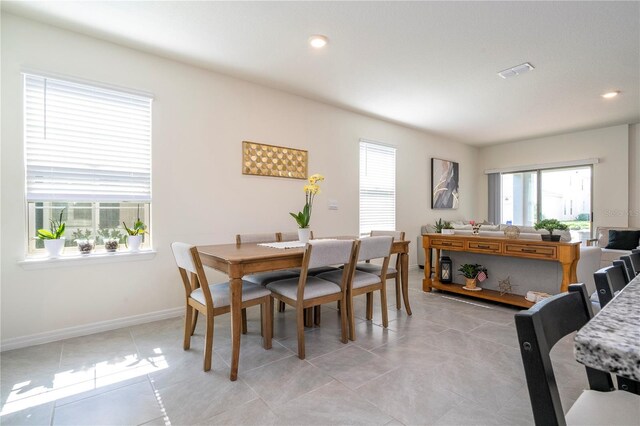 13452 Sagestone Dr, Winter Garden, FL 34787 - dining room featuring plenty of natural light, baseboards, light tile patterned floors, and recessed lighting