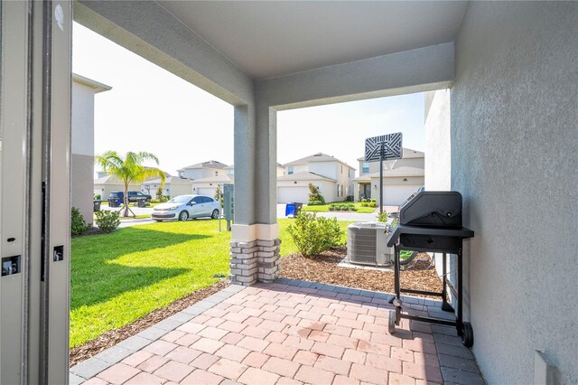 13452 Sagestone Dr, Winter Garden, FL 34787 - view of patio with a residential view, central AC, and grilling area