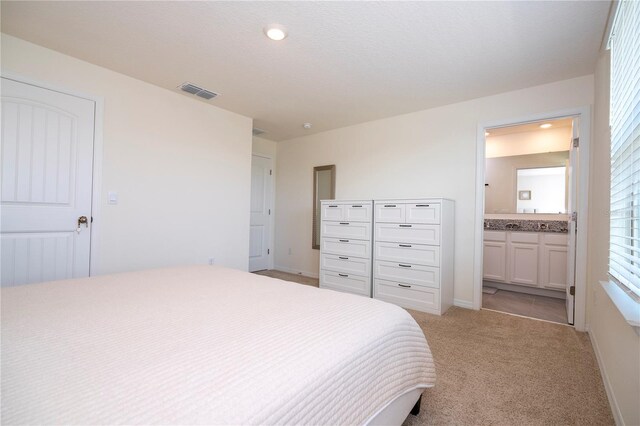 13452 Sagestone Dr, Winter Garden, FL 34787 - bedroom featuring light colored carpet, ensuite bathroom, baseboards, and recessed lighting