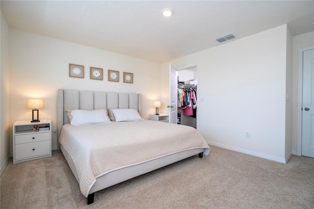 13452 Sagestone Dr, Winter Garden, FL 34787 - bedroom with light colored carpet, baseboards, a spacious closet, and a closet