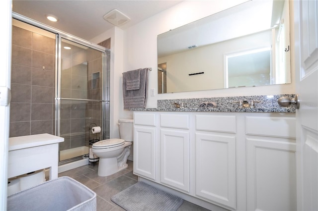 13452 Sagestone Dr, Winter Garden, FL 34787 - full bath with a shower stall, toilet, vanity, tile patterned floors, and recessed lighting