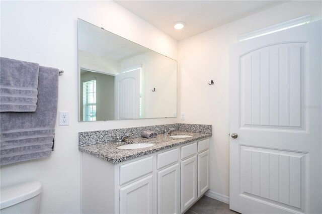 13452 Sagestone Dr, Winter Garden, FL 34787 - bathroom with double vanity and toilet