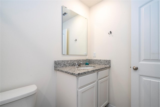 13452 Sagestone Dr, Winter Garden, FL 34787 - half bathroom featuring vanity and toilet