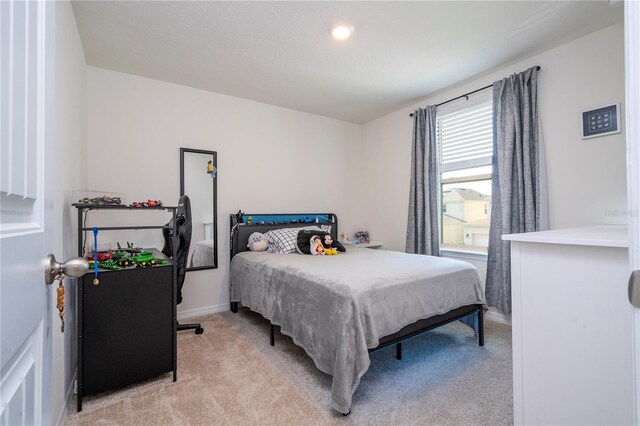 13452 Sagestone Dr, Winter Garden, FL 34787 - bedroom featuring light carpet and baseboards
