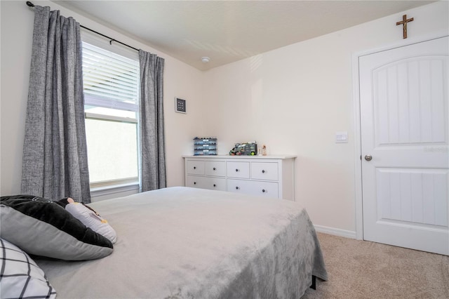 13452 Sagestone Dr, Winter Garden, FL 34787 - bedroom featuring multiple windows, light colored carpet, and baseboards
