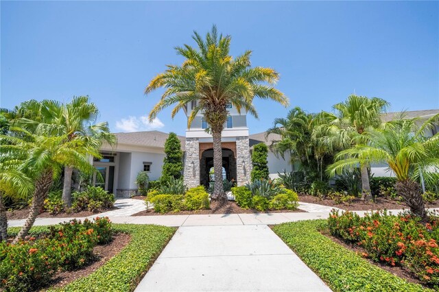 13452 Sagestone Dr, Winter Garden, FL 34787 - view of front of house featuring stucco siding and stone siding
