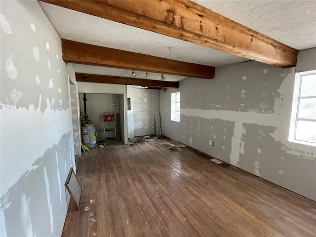 432 2nd Ave NE, Largo, FL 33770 - spare room with wood finished floors and beamed ceiling