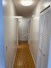 1422 Spalding Rd, Winter Springs, FL 32708 - hallway featuring baseboards and tile patterned floors
