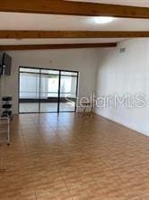 1422 Spalding Rd, Winter Springs, FL 32708 - spare room featuring beamed ceiling