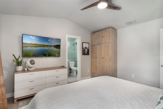 719 Stevelynn Cir, Winter Garden, FL 34787 - bedroom with lofted ceiling, ensuite bathroom, a ceiling fan, baseboards, and wood finished floors