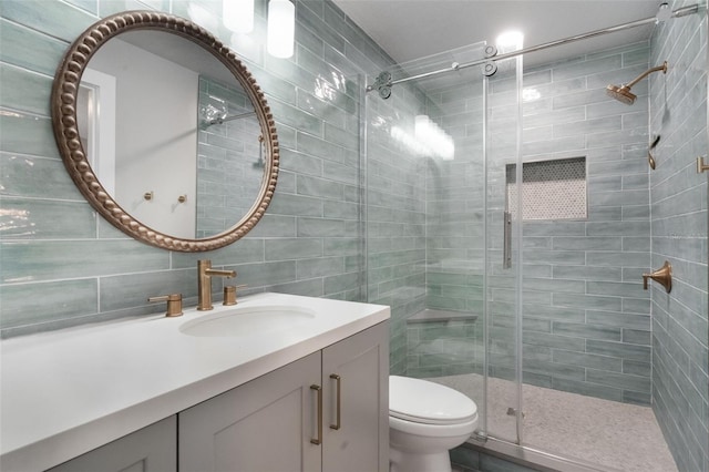 719 Stevelynn Cir, Winter Garden, FL 34787 - full bath featuring a stall shower, vanity, tile walls, and toilet