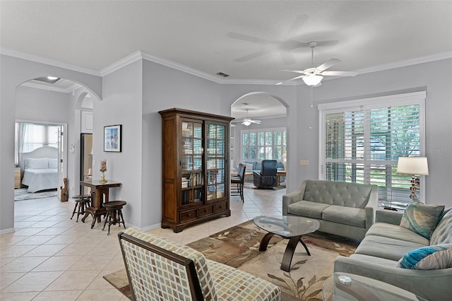 1124 Hidden Blf, Clermont, FL 34711 - living room featuring arched walkways, ceiling fan, light tile patterned flooring, crown molding, and baseboards