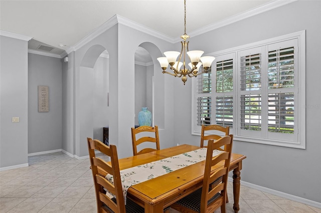 1124 Hidden Blf, Clermont, FL 34711 - dining space with a chandelier, ornamental molding, baseboards, arched walkways, and light tile patterned flooring