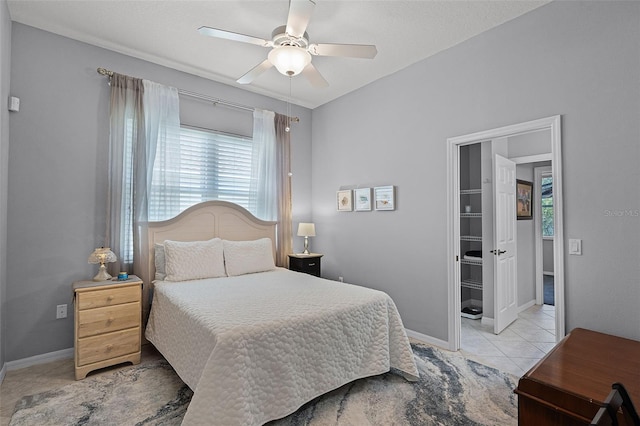 1124 Hidden Blf, Clermont, FL 34711 - bedroom with light tile patterned floors, baseboards, and a ceiling fan