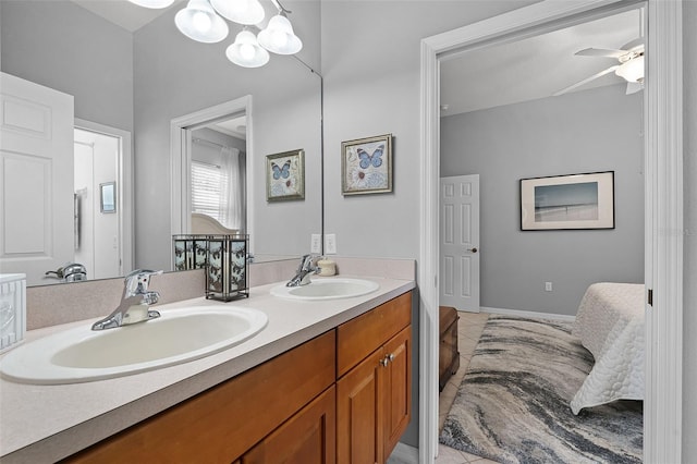 1124 Hidden Blf, Clermont, FL 34711 - ensuite bathroom with double vanity, a chandelier, and a ceiling fan