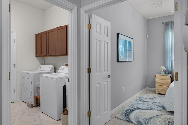 1124 Hidden Blf, Clermont, FL 34711 - washroom with cabinet space, light tile patterned floors, washing machine and dryer, and baseboards