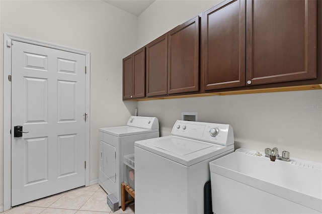 1124 Hidden Blf, Clermont, FL 34711 - washroom with cabinet space, washing machine and clothes dryer, and light tile patterned floors