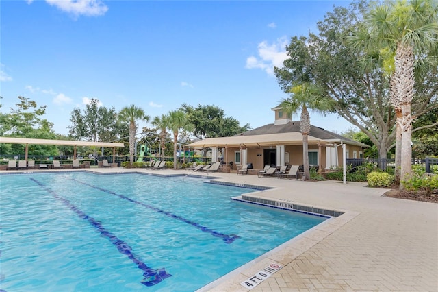 7715 Anselmo Ln, Windermere, FL 34786 - community pool featuring a patio