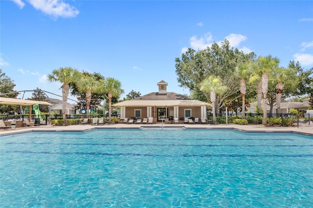 7715 Anselmo Ln, Windermere, FL 34786 - community pool featuring a patio area