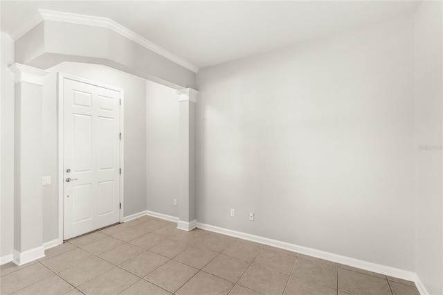 7715 Anselmo Ln, Windermere, FL 34786 - empty room with light tile patterned floors, crown molding, and baseboards