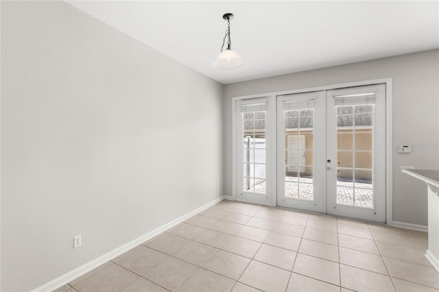 7715 Anselmo Ln, Windermere, FL 34786 - empty room with french doors, plenty of natural light, and baseboards