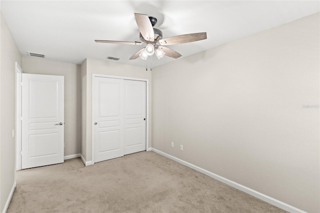 7715 Anselmo Ln, Windermere, FL 34786 - unfurnished bedroom featuring carpet flooring, baseboards, a closet, and a ceiling fan