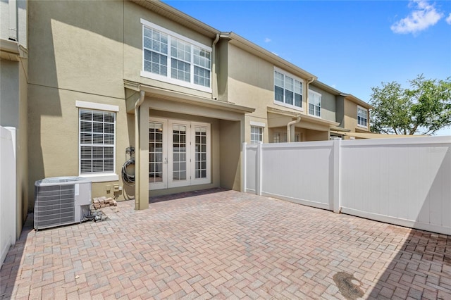 7715 Anselmo Ln, Windermere, FL 34786 - view of patio featuring french doors and central air condition unit